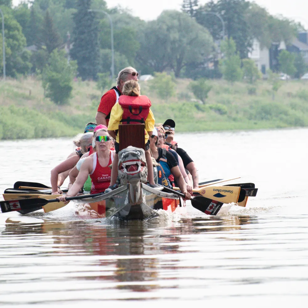 paddlers in a dragon boat on the river